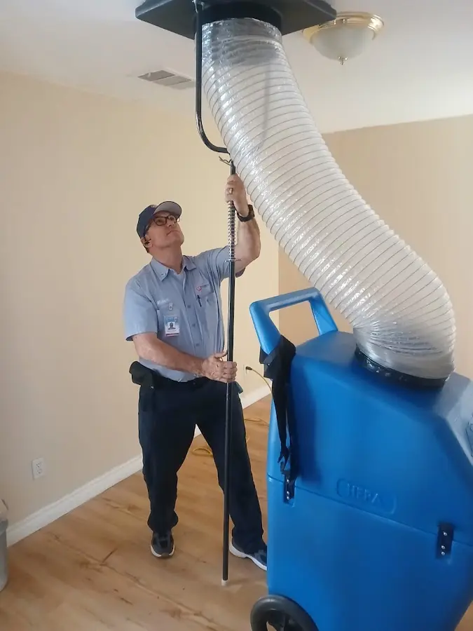 Furnace Tune-Up technician using HEPA equipment in Moultrie